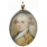 λEnglish School 18th Century Portrait miniature of a gentleman, in a brown coat and powdered hair