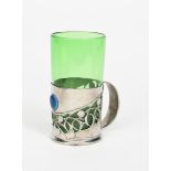 A Liberty Tudric pewter and enamel mug with green glass liner designed by Archibald Knox, model no.