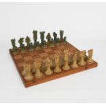 ‡John Maltby (1936-2020) Chess set an early stoneware chess set and board, glazed in shades of green