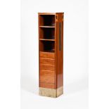 An Austrian Secessionist mahogany side cabinet, three open shelves above a slide and five drawers,