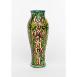 An Art Nouveau Della Robbia pottery vase by Cassandra Annie Walker, slender shouldered form, painted