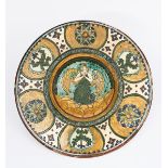 An Art Nouveau wall charger probably Della Robbia Pottery, incised to the well with an angel