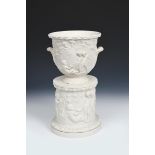 A Copeland Parian Ware jardiniere and stand, cast in low relief with Bacchanalian children