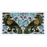 A large pair of William De Morgan Sands End Pottery Persian Parrot tiles, each painted with a parrot