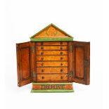 A painted wood desk-top specimen cabinet, rectangular section with pitched roof top, painted with