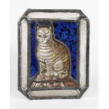 A small stained glass window depicting a seated cat, shaped rectangular form, the central panel