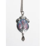 A James Fenton silver and enamel pendant, shield shaped, cast in low relief with Art Nouveau