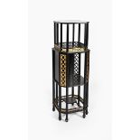 An Aesthetic Movement ebonised wood stand, stepped octagonal form, two shelves above cupboard,