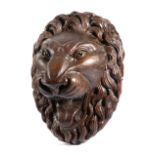 A LARGE FOLK ART CARVED PINE LION MASK POSSIBLY BLACK FOREST, 19TH CENTURY the snarling beast with