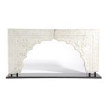 A MUGHAL INDIAN MARBLE ARCH 18TH CENTURY in two sections, carved in relief with leaves and