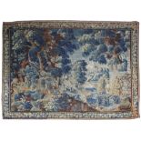 A BRUSSELS VERDURE TAPESTRY LATE 17TH CENTURY worked with figures, in a landscape with cranes and