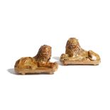 A MATCHED PAIR OF BROWN STONEWARE SALTGLAZED POTTERY LIONS POSSIBLY BRAMPTON, DERBYSHIRE, C.1830-40,