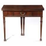A GEORGE III MAHOGANY CARD TABLE C.1770 the fold-over top with a moulded edge, revealing a baize