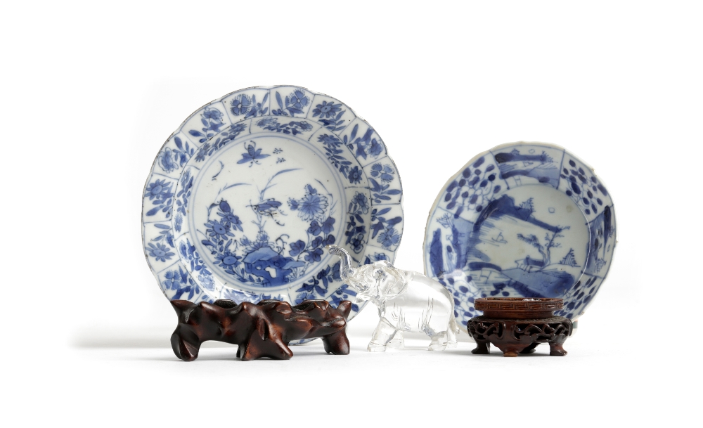 A SMALL CHINESE BLUE AND WHITE PORCELAIN DISH KANGXI (1662-1722) painted with panels of flowers, the