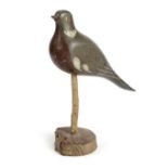 A FOLK ART CARVED AND PAINTED PINE DECOY PIGEON FIRST HALF 20TH CENTURY with glass eyes, mounted