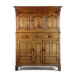 A GEORGE II WELSH OAK PRESS CUPBOARD MID-18TH CENTURY the top section with three arc d'arbalete