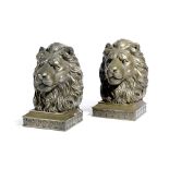 A PAIR OF GILT METAL LION'S HEAD BOOKENDS LATE 20TH CENTURY the bases decorated with a band of