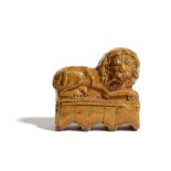 A FOLK ART PRIMITIVE POTTERY MODEL OF A LION POSSIBLY DEVON OR SOMERSET, EARLY 19TH CENTURY on a