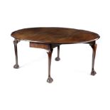 A GEORGE II MAHOGANY DINING TABLE C.1740 the oval drop-leaf top on cabriole legs and claw and ball