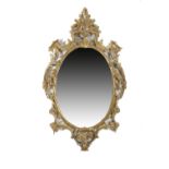 A GILTWOOD WALL MIRROR IN GEORGE III STYLE MID-20TH CENTURY the later oval plate within a leaf,