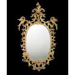 AN EARLY GEORGE III GILTWOOD WALL MIRROR CHIPPENDALE PERIOD, C.1765 the later oval plate in a