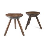 TWO WELSH SYCAMORE AND ASH DAIRY STOOLS 19TH CENTURY each with a dished seat, one with dot owner's