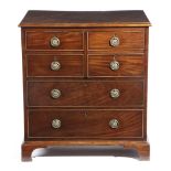 A GEORGE III MAHOGANY COMMODE CHEST OR NIGHT TABLE AFTER A DESIGN BY GEORGE HEPPLEWHITE, C.1790