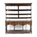 A GEORGE III OAK POTBOARD DRESSER SOUTH WALES, THIRD QUARTER 18TH CENTURY the raised plate rack with
