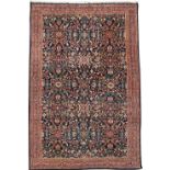 A GOOD SAROUK CARPET NORTH WEST PERSIA, EARLY 20TH CENTURY with an allover floral design 510.5 x