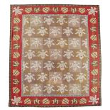 A NEEDLEPOINT TAPESTRY CARPET C.1870-80 the chequerboard centre with Prince of Wales plumes of