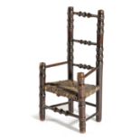 A MINIATURE FAUX BAMBOO OPEN ARMCHAIR EARLY 19TH CENTURY possibly an apprentice piece, with a rush