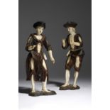 λ A PAIR OF IVORY AND CARVED WOOD FIGURES OF BEGGARS IN THE MANNER OF SIMON TROGER (AUSTRIAN 1683-