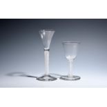 Two wine glasses c.1750-60, one with a drawn trumpet bowl raised on a dense opaque twist stem, the