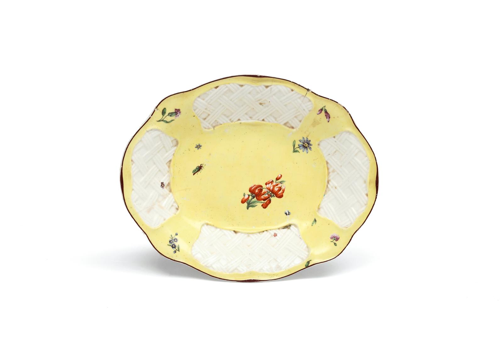A Chelsea basket dish c.1755, painted with small scattered flower sprigs, the sides with four