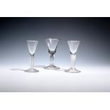 Three small drinking glasses c.1760-70, one with a bell bowl over a plain stem and folded foot,