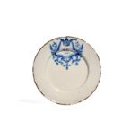 A Delft plate dated 1692, painted in blue with the initials 'AC' above the date 1692, within a