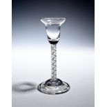 A small wine or cordial glass c.1740-50, the pan-topped bowl raised on a mixed twist stem of an