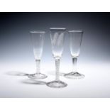 Three ale glasses c.1740-60, one engraved with crossed barley stems over a double series opaque