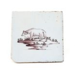 A rare Liverpool delftware tile c.1760, painted in manganese with a bear standing with head slightly