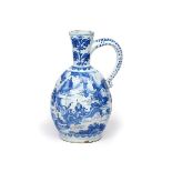 A Frankfurt faïence ewer late 17th/early 18th century, the ovoid moulded body painted in blue with