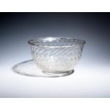 A glass punch bowl c.1760-70, moulded with a honeycomb design, with folded everted rim, 26cm dia.