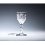 A Jacobite goblet c.1770, the round funnel bowl engraved with a rose and bud spray, an oak leaf,