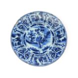 A large Delft charger c.1680, painted in the Kraak manner with two Chinese figures standing in a