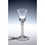 A composite stem wine glass c.1760, the bell bowl with a solid base enclosing two rows of air beads,