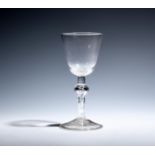 A large wine glass c.1740, with a generous round funnel bowl, the stem with a short plain section