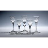 Five small wine glasses c.1730-50, a pair engraved with birds and flower sprays over plain stems,