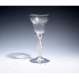 A large wine glass or goblet c.1760, the generous pan-topped bowl raised on an airtwist stem with