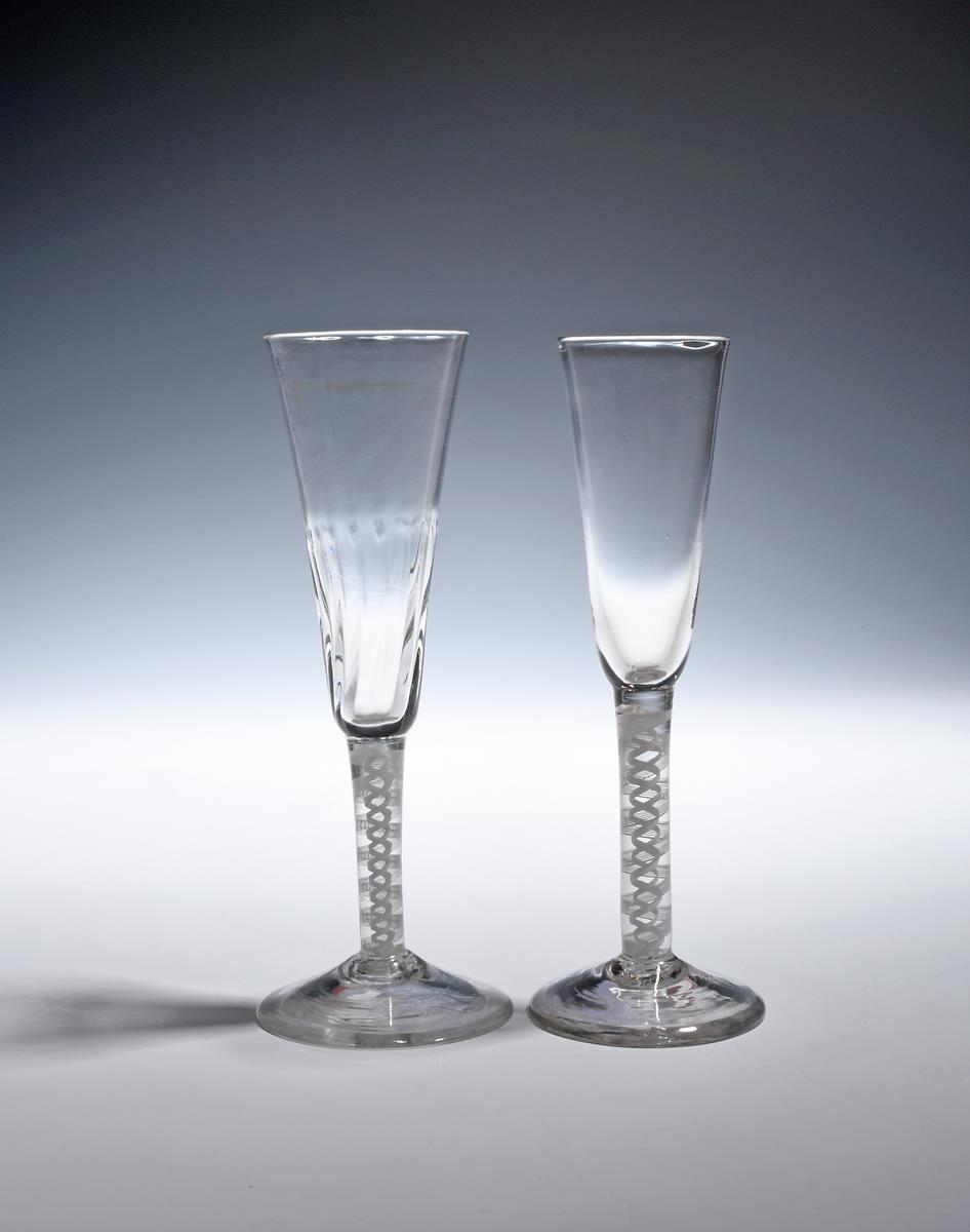 A ratafia glass c.1760, with slender bowl raised on a double series opaque twist stem, and an ale