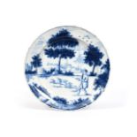 A Delft charger 2nd half 18th century, painted in blue with a figure on foot behind a pack of five