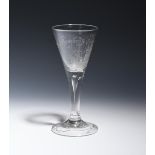 A probable privateer glass c.1750-60, the drawn trumpet bowl engraved with a ship and the